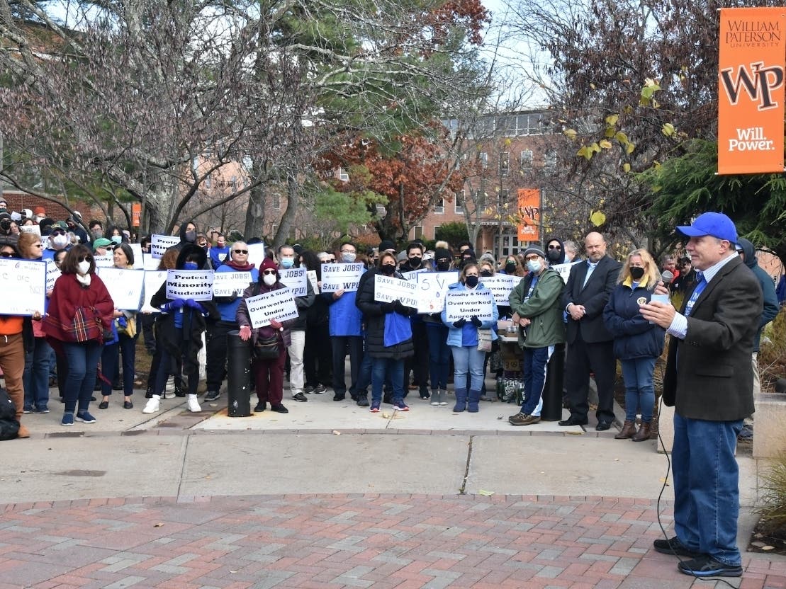 Tim Haresign, president of the Council of New Jersey State College Locals, speaks Friday at a protest against layoffs at William Paterson University.