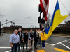 Madison Council President Robert Landrigan, Councilmember John Hoover, Councilmember Eric Range, Mayor Robert H. Conley and Drew University students Pavlo Goloyadov, Oleksii Vilchynskyi and Daria Yashnyk raise the Ukrainian flag.