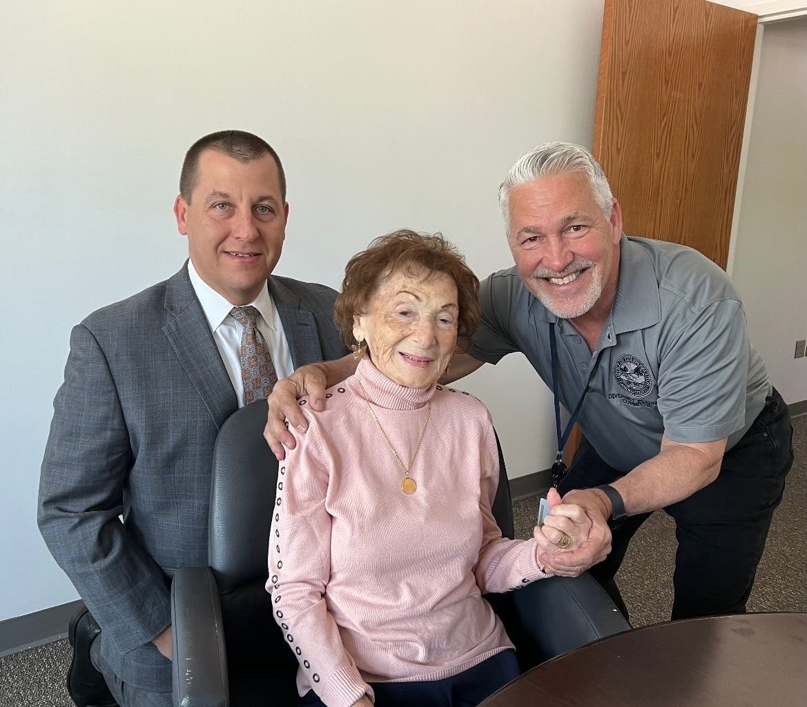 Josephine de Sousa, middle, visited the Camden County Prosecutor's Office, her former employer, on Monday. The 101-year-old is pictured with CCPO Chief Robert Ferris and Chief of Staff Michael Mangold.