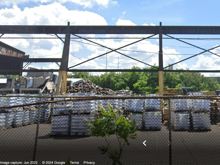 Heavy smoke emanated from a Camden junkyard on Monday when a pile of shredded materials caught fire.