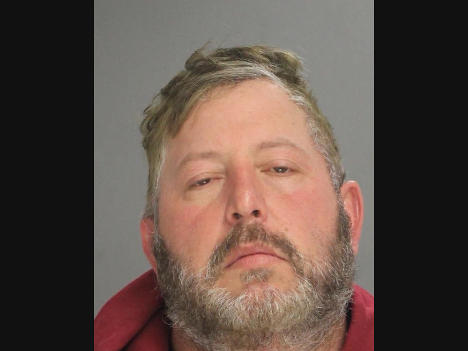 A former assistant fire chief was found guilty Monday of ethnic intimidation after authorities say he made racist threats against a Black driver while illegally blocking the roadway.