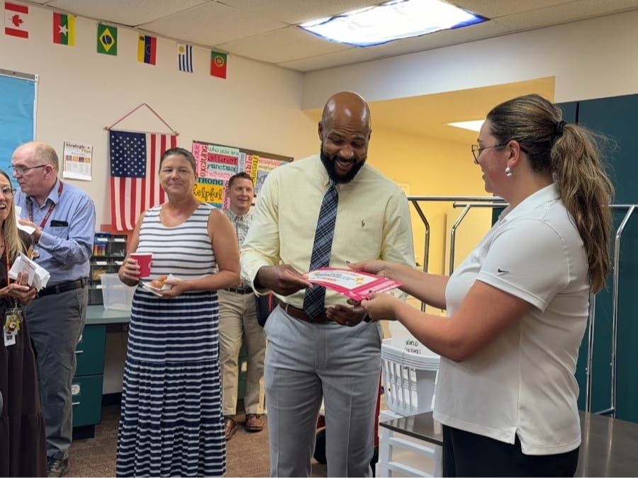 Dunkin' surprised Haverford High School teacher Leon Smith with tickets to the Philadelphia Eagles' season opener.