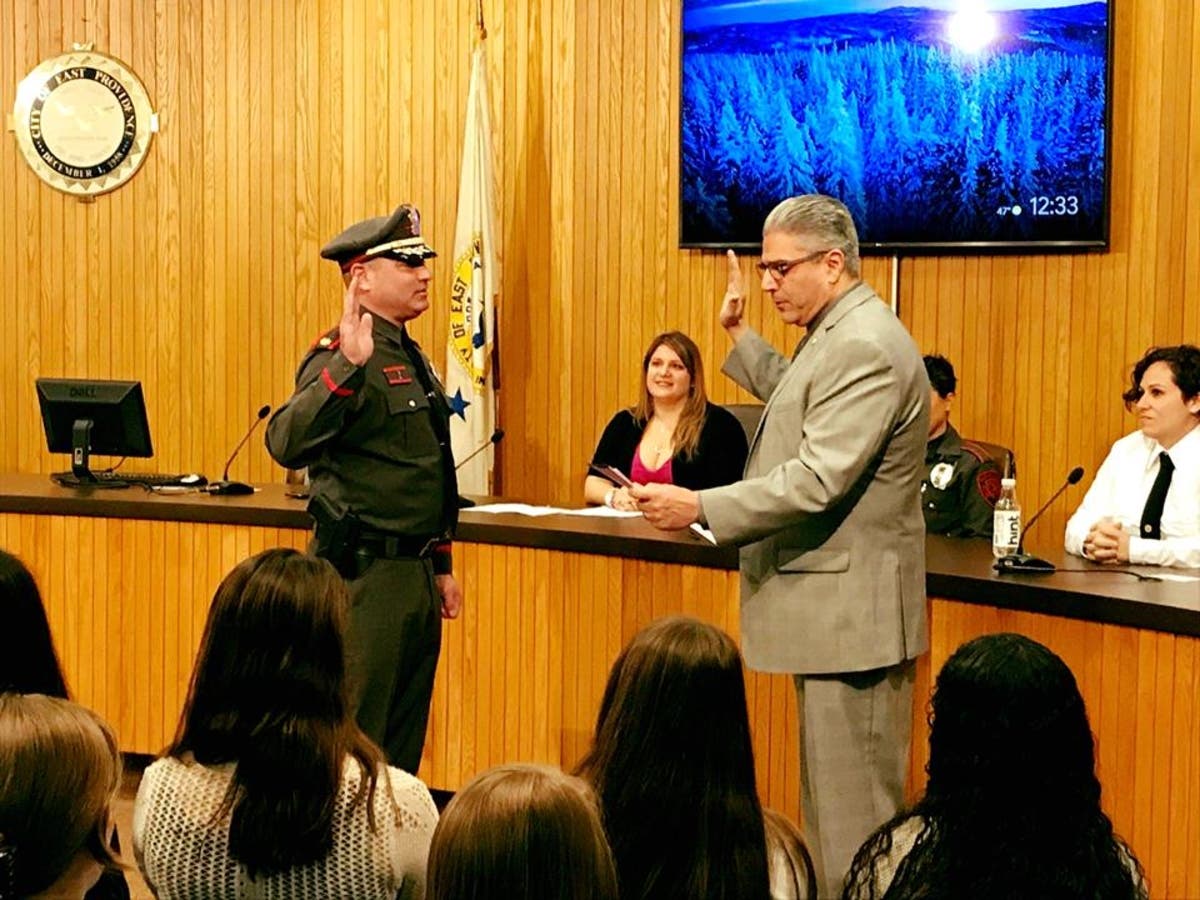 Mayor Bob DaSilva (at left) swears in William Nebus at East Providence City Hall. 