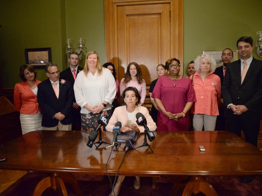 Governor Gina Raimondo signed the state's abortion rights bill into law on Thursday night. 