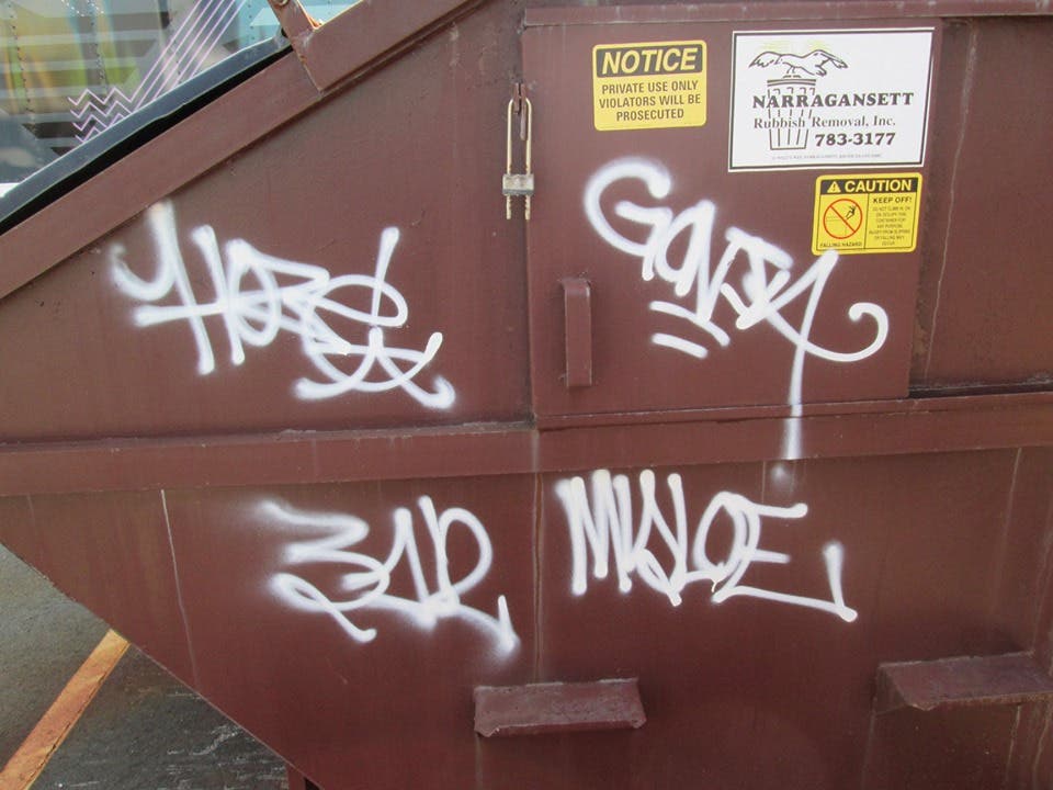 The suspects' "less than exceptional" tags on the dumpster. 