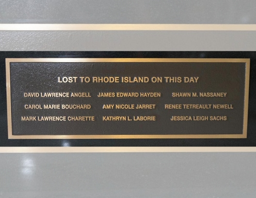 A new plaque at the State House 9/11 memorial bears the names of the nine Rhode Islanders who died on 9/11.