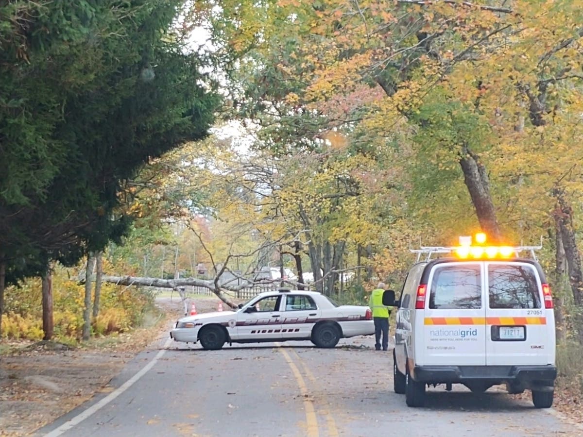 Downed trees and power lines left roads across Rhode Island impassable.