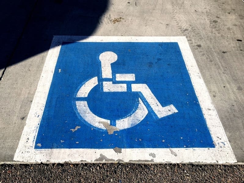 A new law would allow police to tow cars that are illegally parked in handicapped parking spots. 
