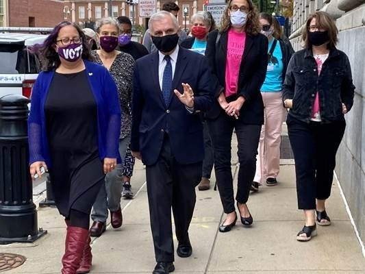 Front, from left: Rep. Rebecca Kislak, U.S. Sen. Jack Reed, Rabbi Sarah Mack and Sen. Gayle Goldin lead a march at U.S. District Court in Providence today to honor the late Justice Ruth Bader Ginsburg.