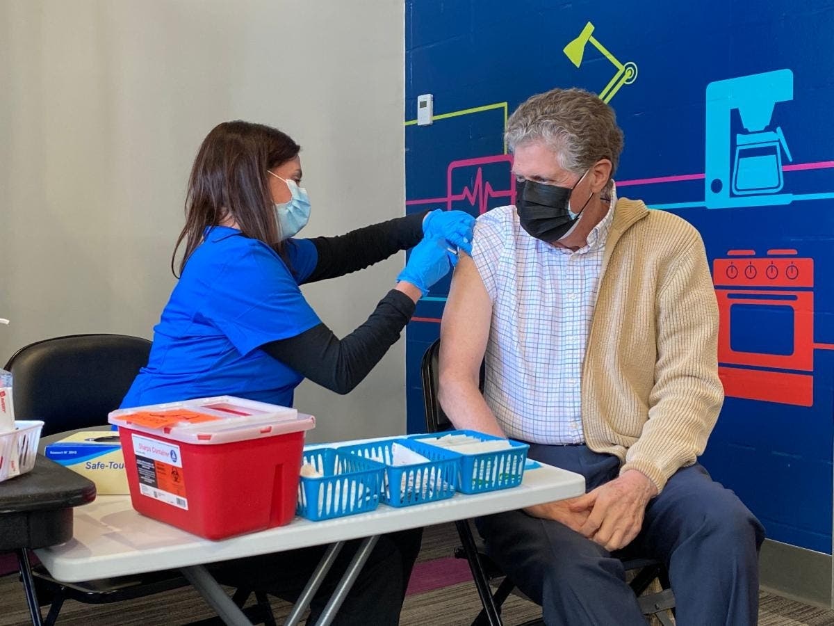 McKee and his wife received the first dose of the Pfizer vaccine at the Dunkin' Donuts Center. 