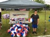 Tyler Monte setting up to hand out beach balls