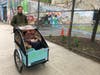 Choresh Wald, who launched the petition for an Avenue B bike lane, with his kids in a cargo bike.