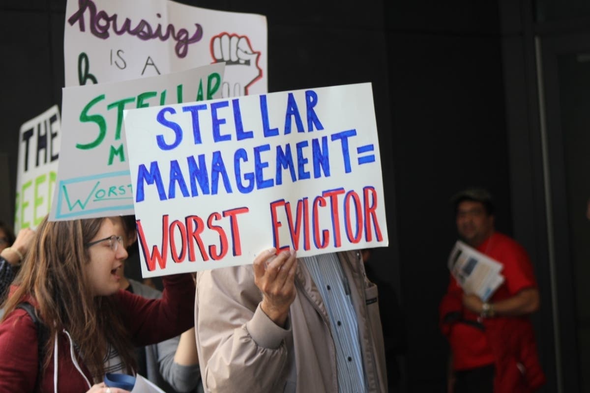 Tenants rallied at Stellar Management's offices at 156 William St. Wednesday.