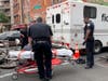 Two different incidents in the East Village left an e-biker hit by a cop car and a teen slashed in the face, cops said.