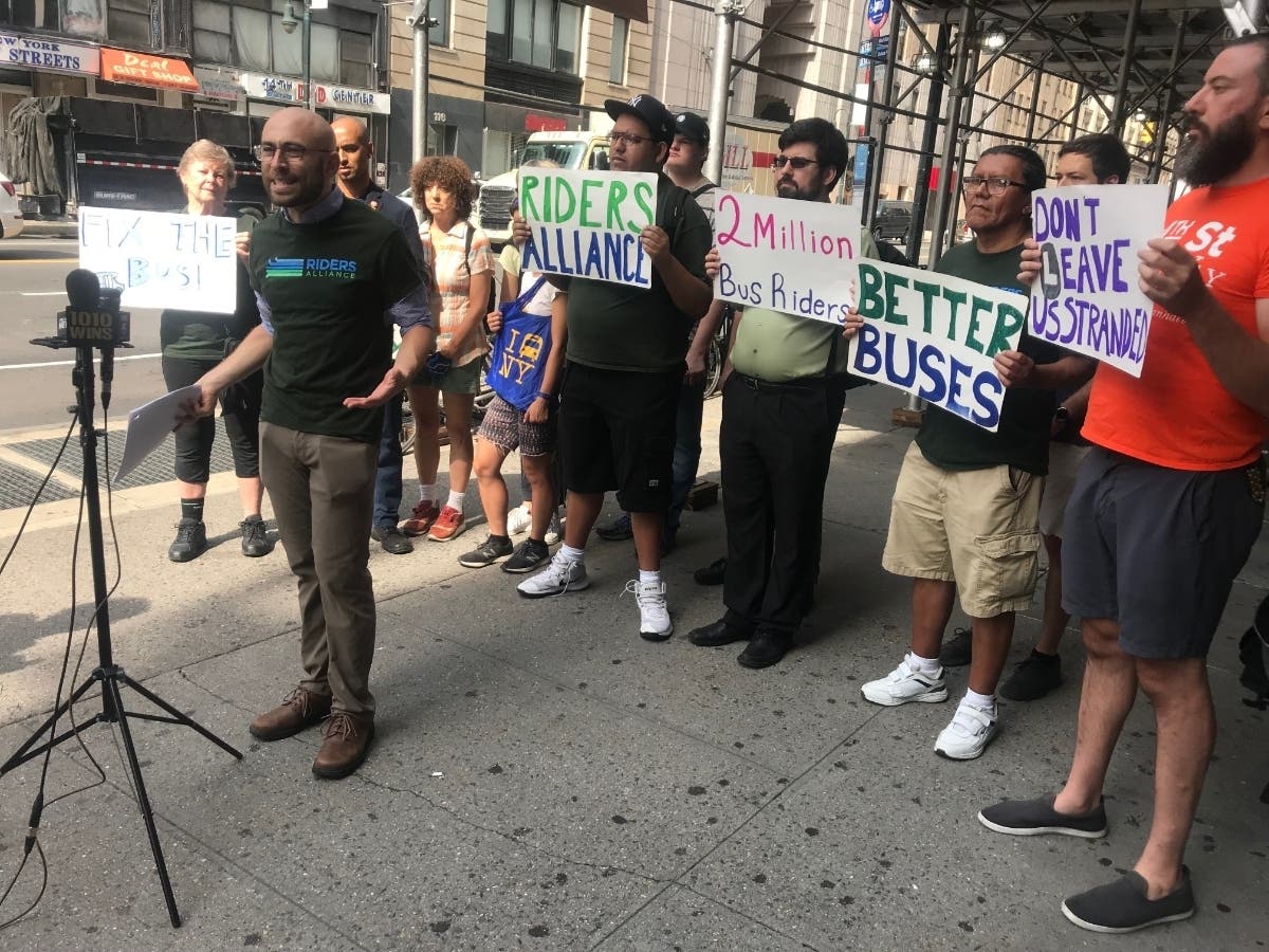 Danny Pearlstein of the Riders' Alliance rallies with transportation advocates.