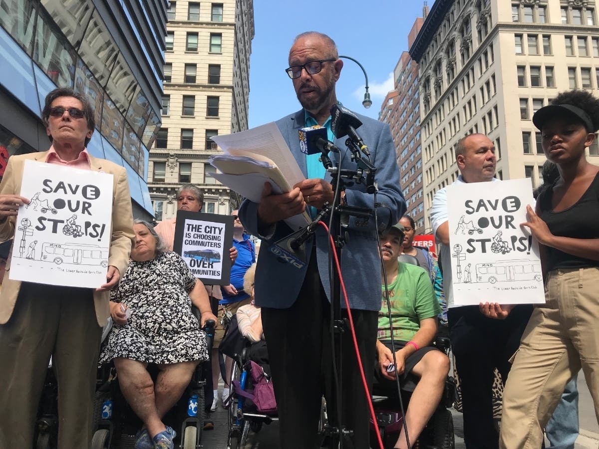 Arthur Schwartz rallies with disability rights groups over a planned lawsuit against the MTA.