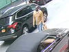Cops are searching for two men involved in snatching a necklace from a woman sitting in a car, the NYPD said.