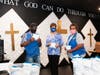 PCI Food Stock Clerk  Willie Montgomery (left) and Pantry Director Sharon Nixon (right) welcome masks from United Way's Gail Carroll (center)