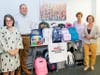 Pediatric Healthcare Associates (PHA) donates filled backpacks to United Way.  From left, Margo Amgott, United Way Interim CEO, Dr. Nimrod Dayan, PHA Chief Medical Officer,  Dr. Andrea Hagani, PHA CEO & President, Faith Douglass, UW Development Director