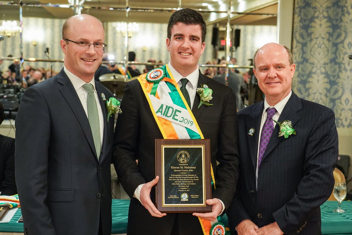 Kieran Mahoney, center, with parade chairman Sean Lane and parade chief administrator Hilary Beirne.