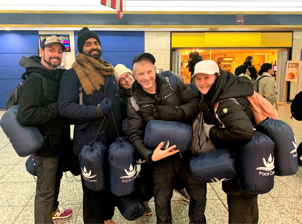 Jayson Conner (left) and Jeffrey Newman (center) with Backpacks For The Street volunteers during January's polar vortex.