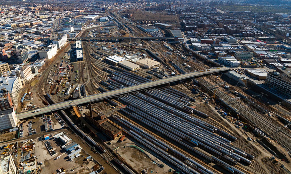 Sunnyside Yard, pictured here, envisions a 180-acre parcel of new land built over the busy train yard in Queens.