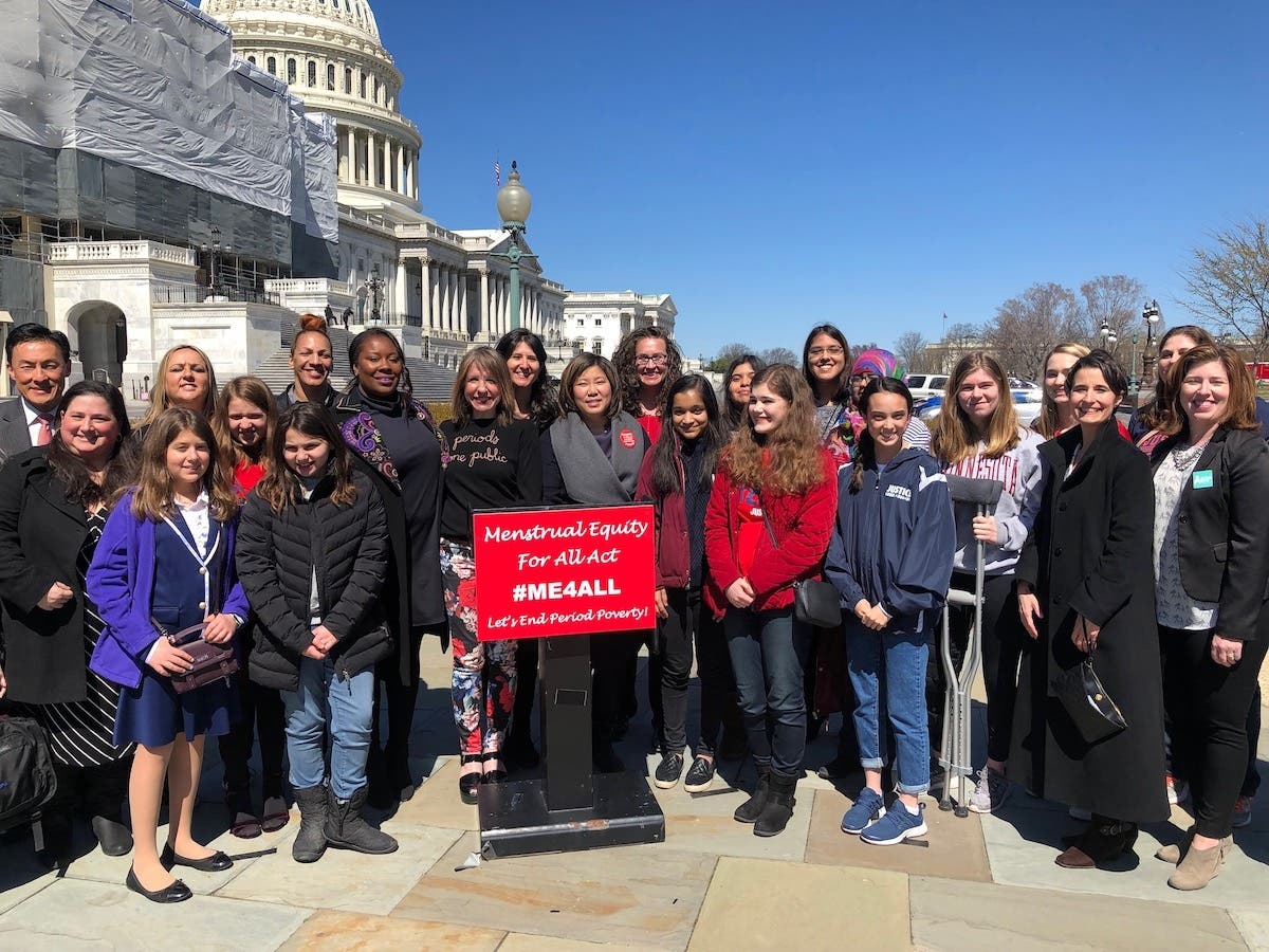 Congresswoman Grace Meng with menstrual equity advocates during the bill’s announcement.