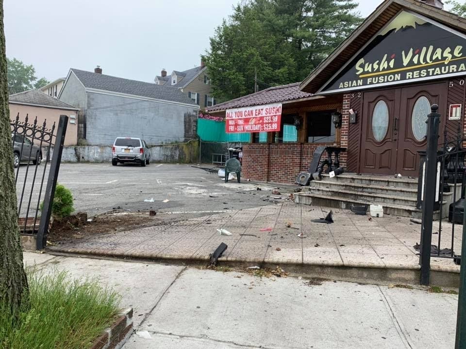 A driver burst through the gate outside Sushi Village in Auburndale early Thursday morning.