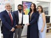 ECLC Executive Director Peter Petrou (far left) accepts a Proclamation from Abe Polakunnil, Senior Aide, Intergovernmental Affairs, Office of Gov. Mikie Sherrill, with PRIDE Director Christina Klimkowski and Lauren Guerrero (far right).