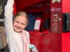Shauna’s daughter, Kennedy, putting popcorn on a movie rental machine.“