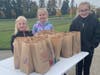 Ella, Kennedy, and Alya, supervise the kit pick up, at Sunset Park.