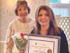 June Portnoy accepts the Community Partner of the Year Award for O’Rourke Media Group from Lynn Detwiler, SIIR Public Awareness Chair.