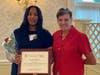 Deanna Bembury accepts the Ginny Cooper Live Your Dream Grant from Diane Smith, past SIIR president.