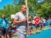 Former Boston College and Boston Celtics guard Dana Barros, who is from Mattapan, talks with young basketball players at last year's Hoops And Hope at Medford's Dugger Park.