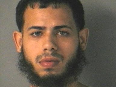 Merrimack Police said Luis Angel Cruz was one of two men arrested on Hoyt Street after illegal cash exchange, car crash and chase.