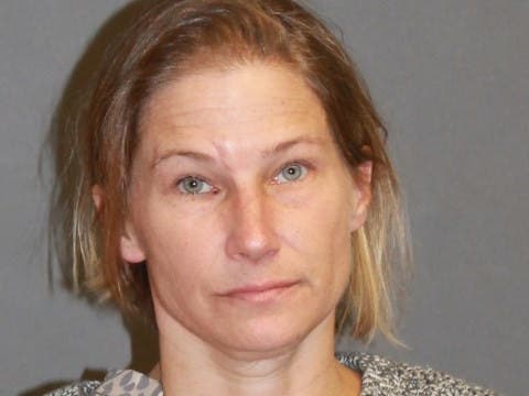 Nashua Police said Melanie Deschene, 38, took control of more than $1,500 belonging to man living with family.