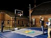 Nashua Mayor Jim Donchess shoots a basket at the public unveiling of the new court at Arlington Street Community School in Nashua.