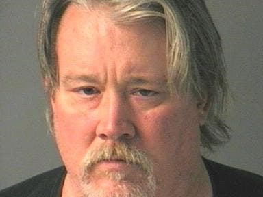 Merrimack police said Robert Norman, 55, of Manchester, was asleep at the wheel of a running car in the parking lot of a closed restaurant.