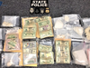 Massachusetts State Police charged two men with drug trafficking after finding nearly three kilograms of cocaine, fentanyl and cash in raids in Brockton and Easton.
