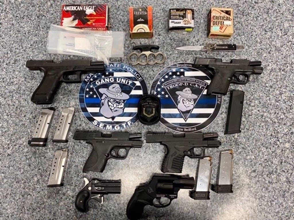 Police said the four men, and one woman, charged were in Brockton to attend a memorial service for an Outlaws Motorcycle Gang member.