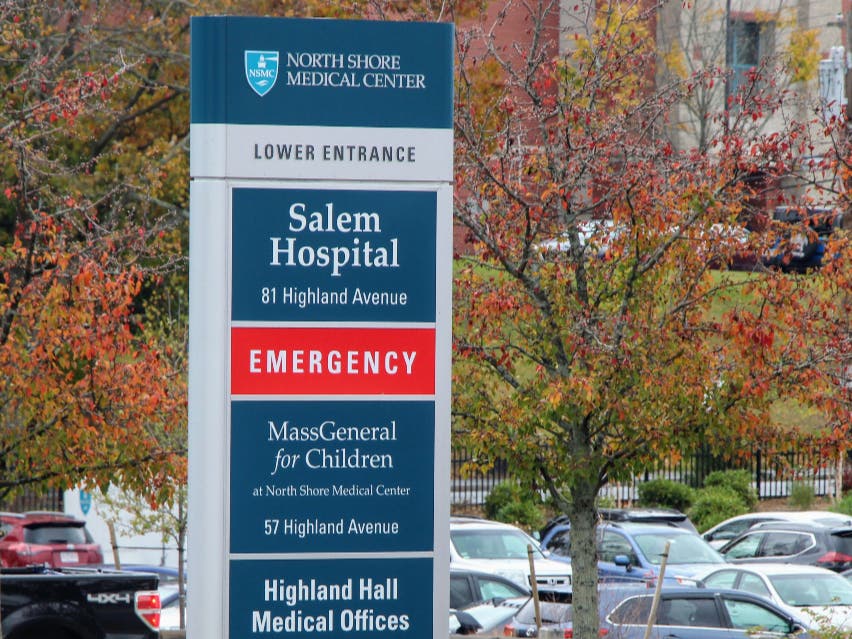 Signs are posted to help visitors and patients navigate the main entrance closure at the North Shore Medical Center in Salem.