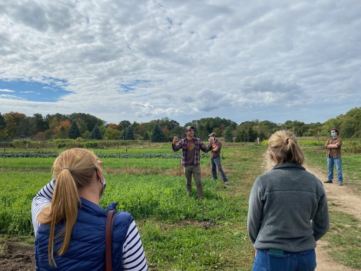 New Entry Beginning Farmer Educator Benjamin Zoba, center, speaks to various stakeholders about New Entry's farming educational opportunities and available resources for farmers starting their businesses.