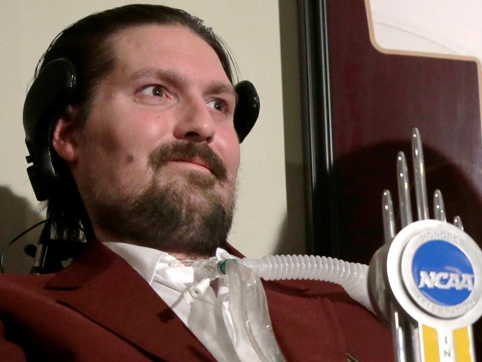 In this Dec. 13, 2016, file photo, former Boston College baseball captain Pete Frates smiles after he was presented with the annual NCAA Inspiration Award at his home in Beverly.