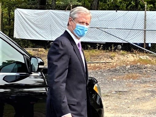 Gov. Charlie Baker said it is up to vaccination site managers such as Curative at the mass vaccination site in Danvers to manage their vaccine so that all those with appointments can get one, and there are virtually no wasted doses.