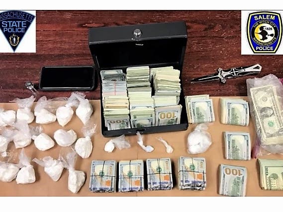 State police said they encountered a threatening crowd of bystanders as they served a warrant for a home invasion charge on Palmer Street on Wednesday.