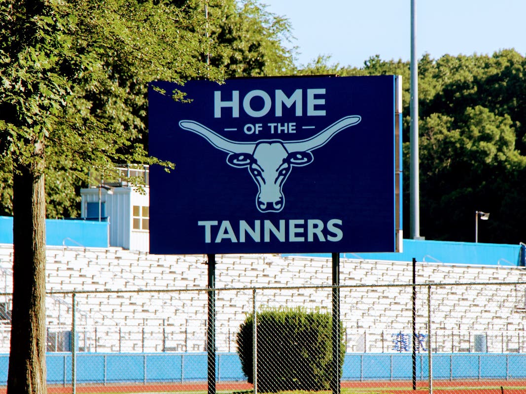 District officials said it was determined football players entered the locker room unsupervised and engaged in simulated sex acts, while clothed, while voices could be heard using homophobic and racial slurs.