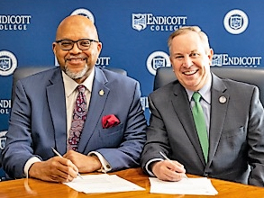 Beverly Hospital President Tom Sands, left, and Endicott College President Steven DiSalvo sign the nursing collaboration agreement.