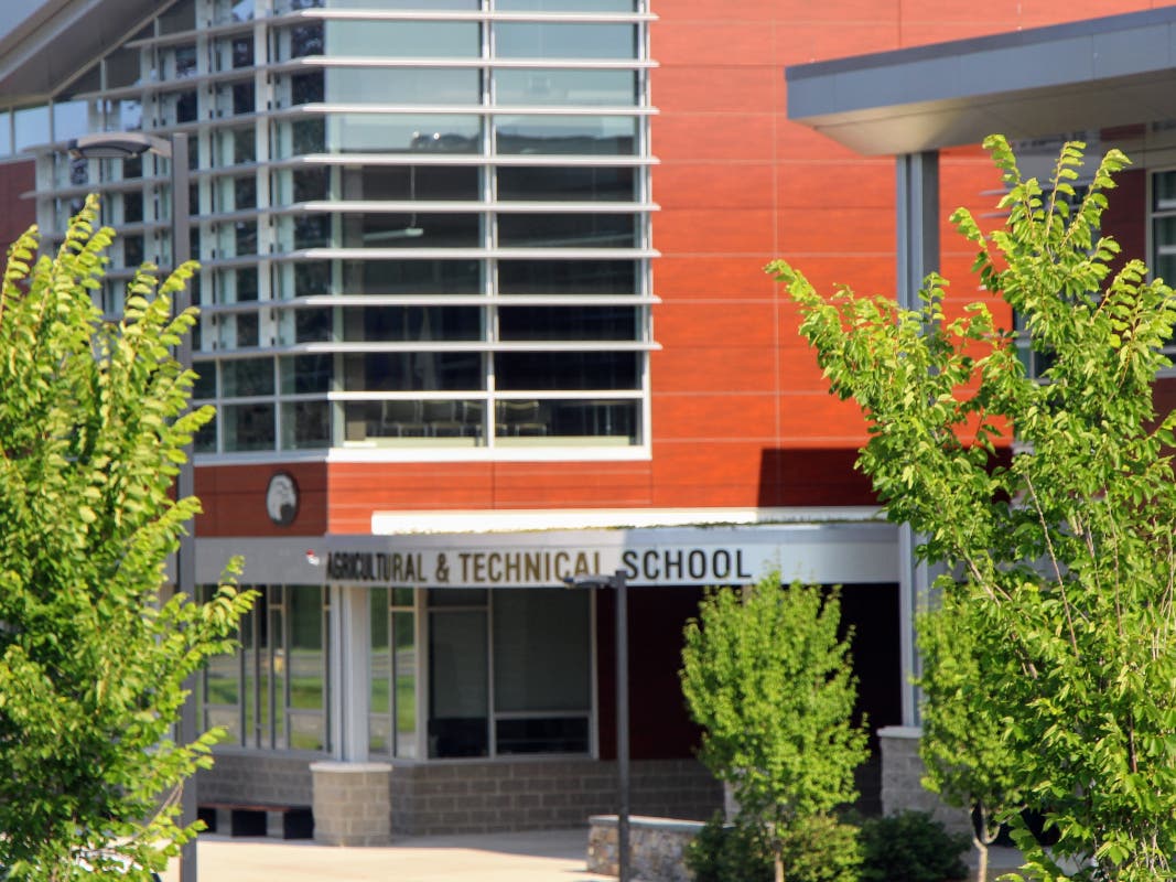 Danvers town meeting members will decide in May whether to restrict the number of town students attending the vocational and agricultural school each year in an attempt to curb escalating payments to the high school.
