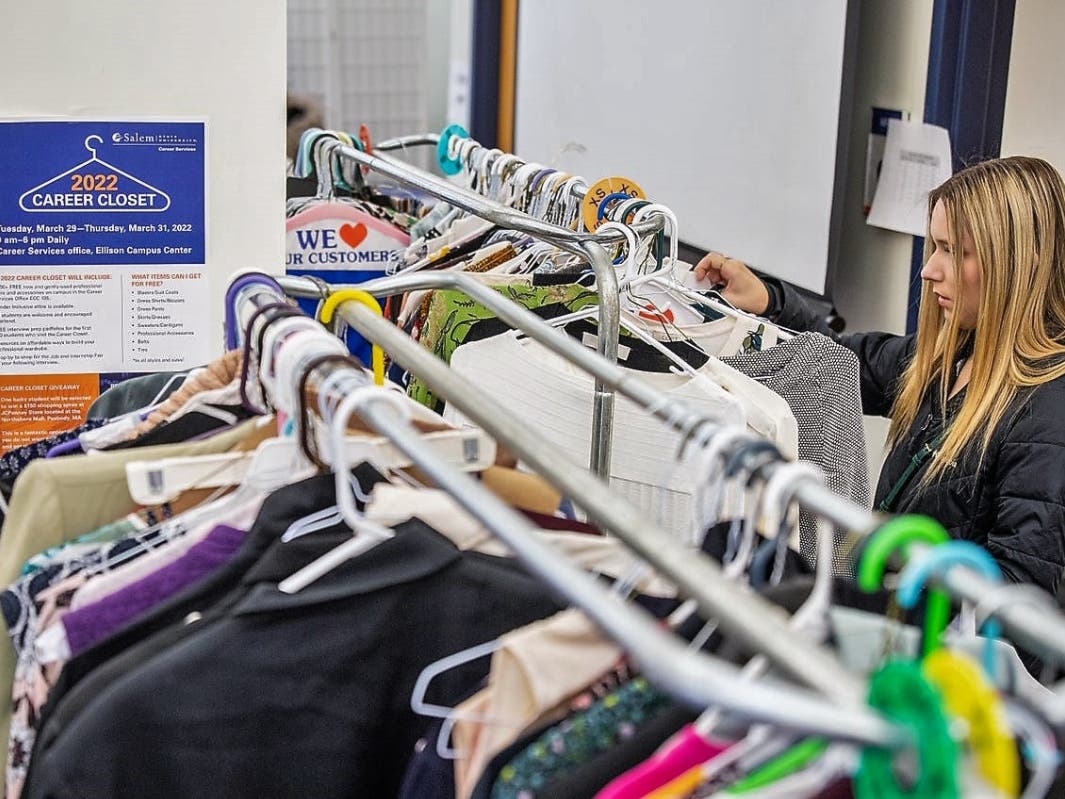 Salem State student Natalia Caron searches through items available at the Salem State Univesity Career Closet event.