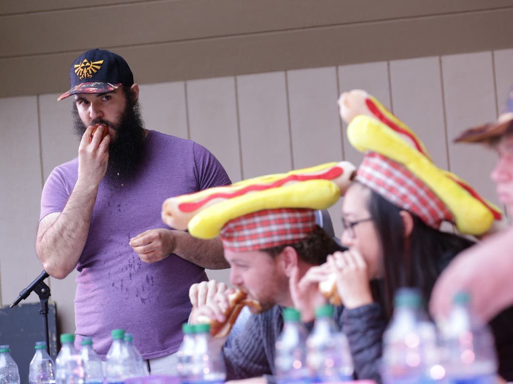 Brandon Wood of Warren stands tall as the top hot dog eater at the 2022 Topsfield Fair.